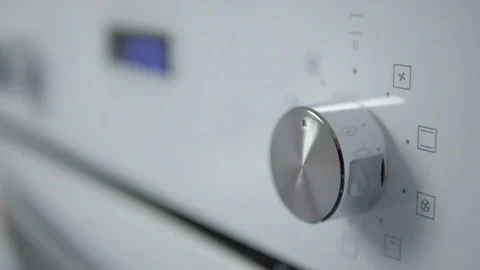 Metallic Toggle Switch of the Cooker Oven. Close-up View. Digital Clock of oven. Stock Footage 84830999