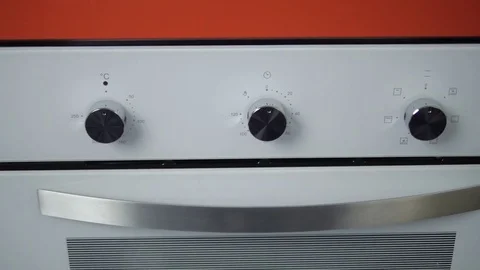 Metallic Toggle Switch of the Cooker Oven. Close-up View. Digital Clock of oven. Stock Footage 84831037