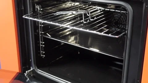 Metallic Toggle Switch of the Cooker Oven. Close-up View. Digital Clock of oven. Stock Footage 84831073