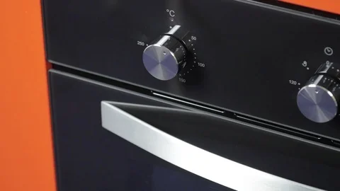Metallic Toggle Switch of the Cooker Oven. Close-up View. Digital Clock of oven. Stock Footage 84831138