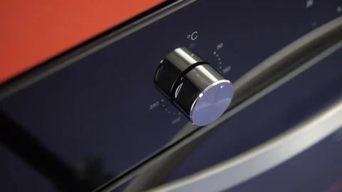 Metallic Toggle Switch of the Cooker Oven. Close-up View. Digital Clock of oven. Stock Footage 84831229