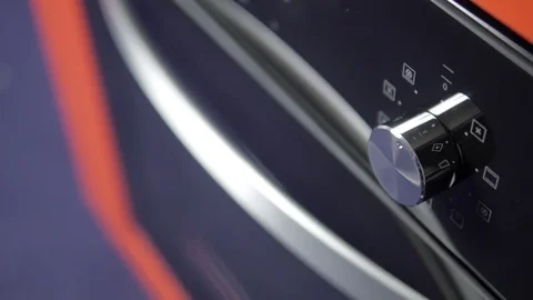 Metallic Toggle Switch of the Cooker Oven. Close-up View. Digital Clock of oven. Stock Footage 84831274