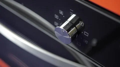 Metallic Toggle Switch of the Cooker Oven. Close-up View. Digital Clock of oven. Stock Footage 84831303
