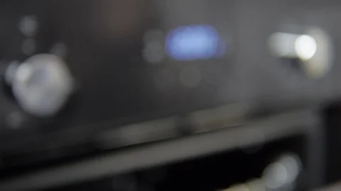 Metallic Toggle Switch of the Cooker Oven. Close-up View. Digital Clock of oven. Stock Footage 84831471