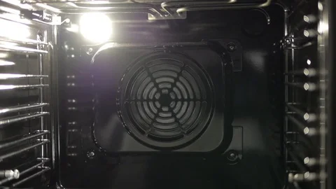 Metallic Toggle Switch of the Cooker Oven. Close-up View. Digital Clock of oven. Stock Footage 84831639