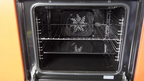 Metallic Toggle Switch of the Cooker Oven. Close-up View. Digital Clock of oven. Stock Footage 84831701