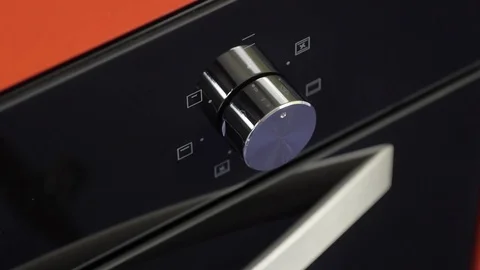 Metallic Toggle Switch of the Cooker Oven. Close-up View. Digital Clock of oven. Stock Footage 84831887