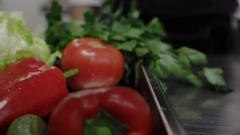 Metallic tray with vegetables in a restaurant kitchen, slide to the right. Stock Footage 114889149