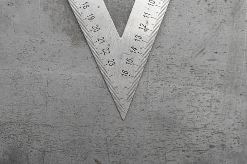 Metallic Try square on metallic sheet background. Stock-Fotos