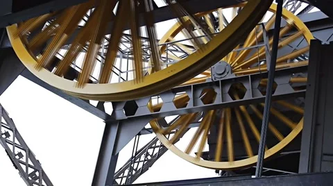 Metallic wheels of Eiffel Tower turn Stock Footage 6532092