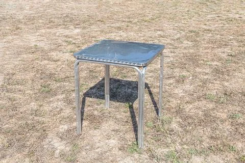 Metallic white table on the gray background Stock Photos