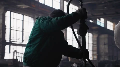 Metallurgy factory workers using construction tools while working. Stock Footage 296546008