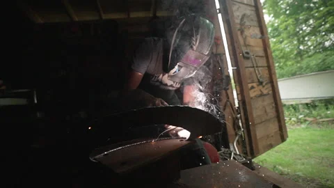 Metalsmith Working in Shed Stock Footage 243204349