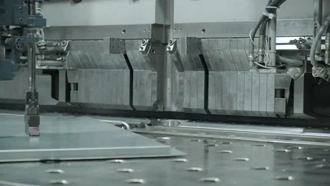 Metalware factory: automatic production. The machine bends thin metal Stock Footage 142052833