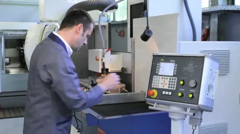 Metalworker operates CNC machine - 5 Stock-Footage 11899841