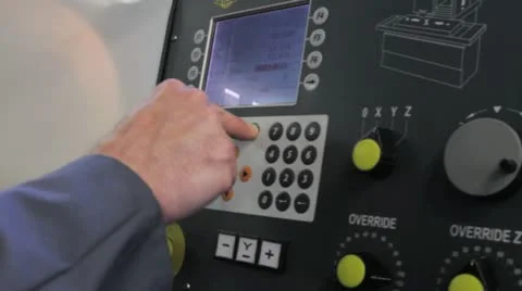 Metalworker operates CNC machine - closeup panel - 2 Stock Footage 11899865