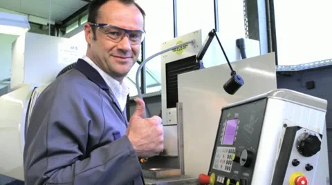 Metalworker operating CNC OK Stock Footage 11899901