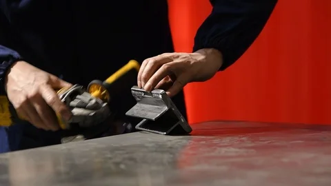 Metalworker at work with his grinder Stock Footage 125792619