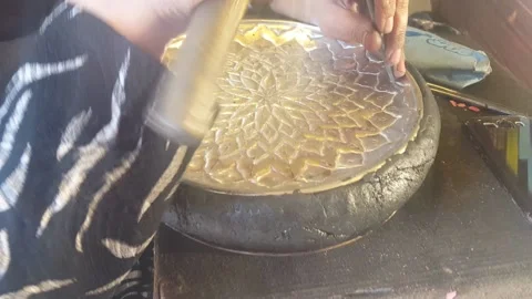 Metalworkers making patterned dishes 20161025 164020 Stock Footage 134038740