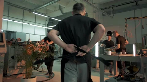 Metalworkers meet before the start of a work shift Stock Footage 179686459