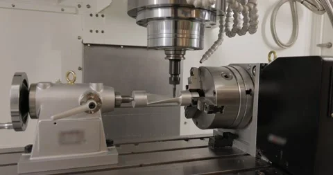 Metalworking CNC milling machine. Cutting metal modern processing technology. Stock Footage 217526505