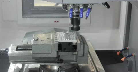 Metalworking CNC milling machine. Cutting metal modern processing technology. Stock Footage 236761820