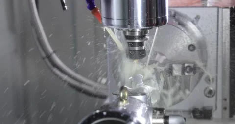 Metalworking CNC milling machine. Cutting metal modern processing technology. Stock Footage 239627889