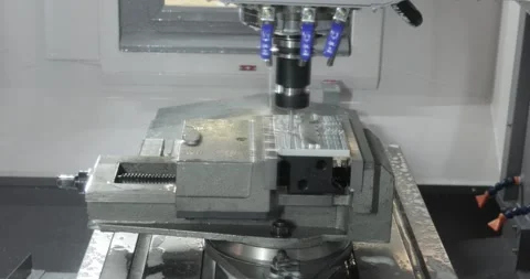 Metalworking CNC milling machine. Cutting metal modern processing technology. Stock Footage 240539996