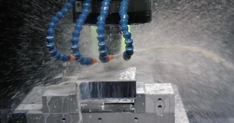 Metalworking CNC milling machine. Cutting metal modern processing technology. Stock Footage 242604989