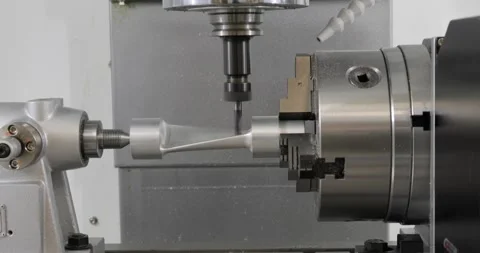 Metalworking CNC milling machine. Cutting metal modern processing technology. Stock Footage 262757579