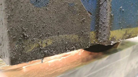 Metalworking industry: a process of wet flat steel abrasion on horizontal Stock Footage 123561560