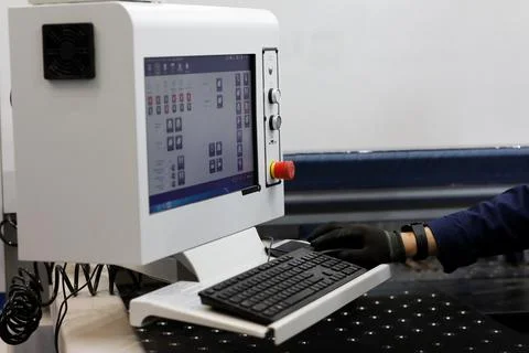 Metalworking machine operator at the control panel Stock Photos