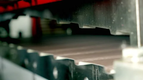 Metalworking. A special machine cuts the sheets of metal tiles. Close up. Metal Stock Footage 197384541