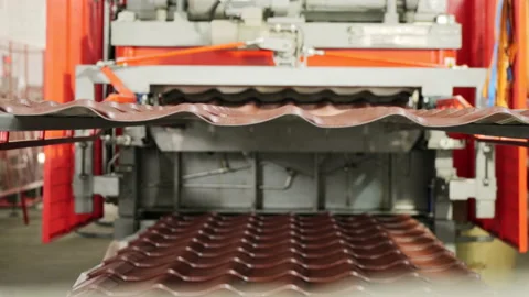 Metalworking. The special machine prepares sheets of a metal tile. The line of Video stock 197382621