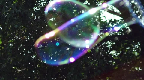 Metamorphosis of big soap Bubbles in Slow Motion. Big bubble shimmering Stock Footage 67090129