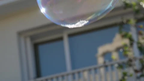 Metamorphosis of big soap Bubbles in Slow Motion. Close up view of beautiful big Stock Footage 301432802