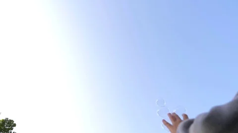 Metamorphosis of a large soap Bubbles in a slow motion. Close-up of a beautiful Stock Footage 82588733