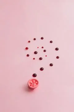 Metaphor of the anus on a pink background. concept of the cause rectal bleeding Stock Photos