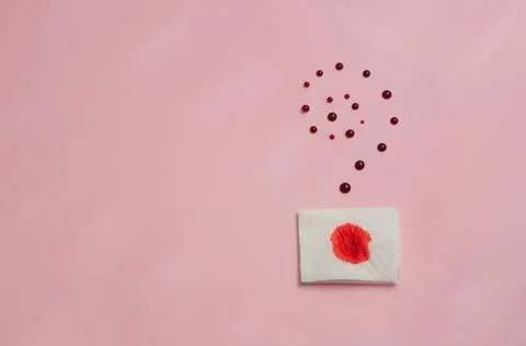 Metaphor of the anus on a pink background. concept of the cause rectal bleeding Stock Photos