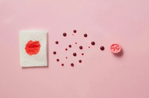 Metaphor of the anus on a pink background. concept of the cause rectal bleeding Stock Photos