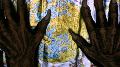 Metaphorical paws of the devil and ancient map of the world Stock Footage 229957839