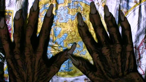 Metaphorical paws of the devil and ancient map of the world Stock Footage 229957852