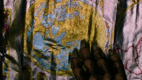 Metaphorical paws of the devil and ancient map of the world Stock Footage 229957862