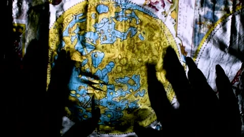 Metaphorical paws of the devil and ancient map of the world Stock Footage 229957997