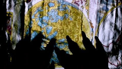 Metaphorical paws of the devil and ancient map of the world Stock Footage 229958067