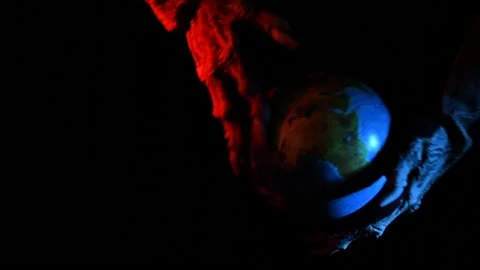 Metaphorical paws of the devil play with the planet Earth Stock Footage 221272122