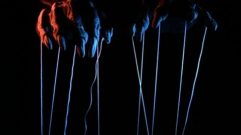 Metaphorical paws of the devil with threads for control Stock Footage 221271671