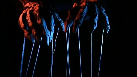 Metaphorical paws of the devil with threads for control Stock Footage 221271715