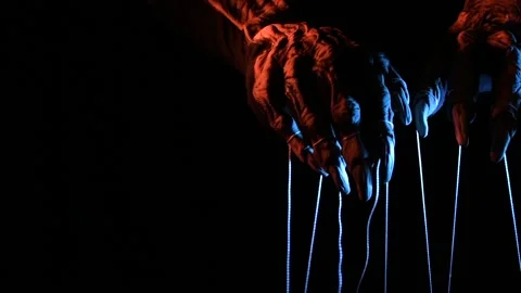 Metaphorical paws of the devil with threads for control Stock Footage 221271716