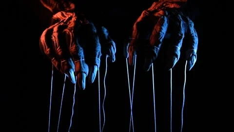 Metaphorical paws of the devil with threads for control Stock Footage 221271721